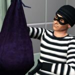 A masked burglar holds up a bag full of stolen goods